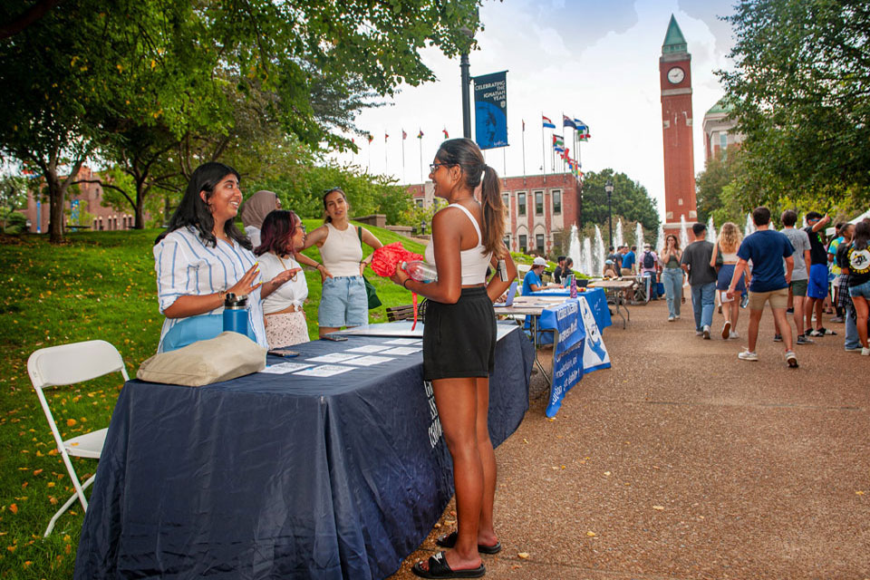 SLU students chatting at the fall campus involvement fair. 