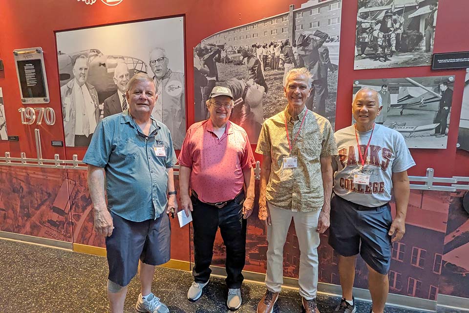 Alpha Pi Sigma Alpha Pi Sigma Fraternity brothers pose for a photo at a reunion