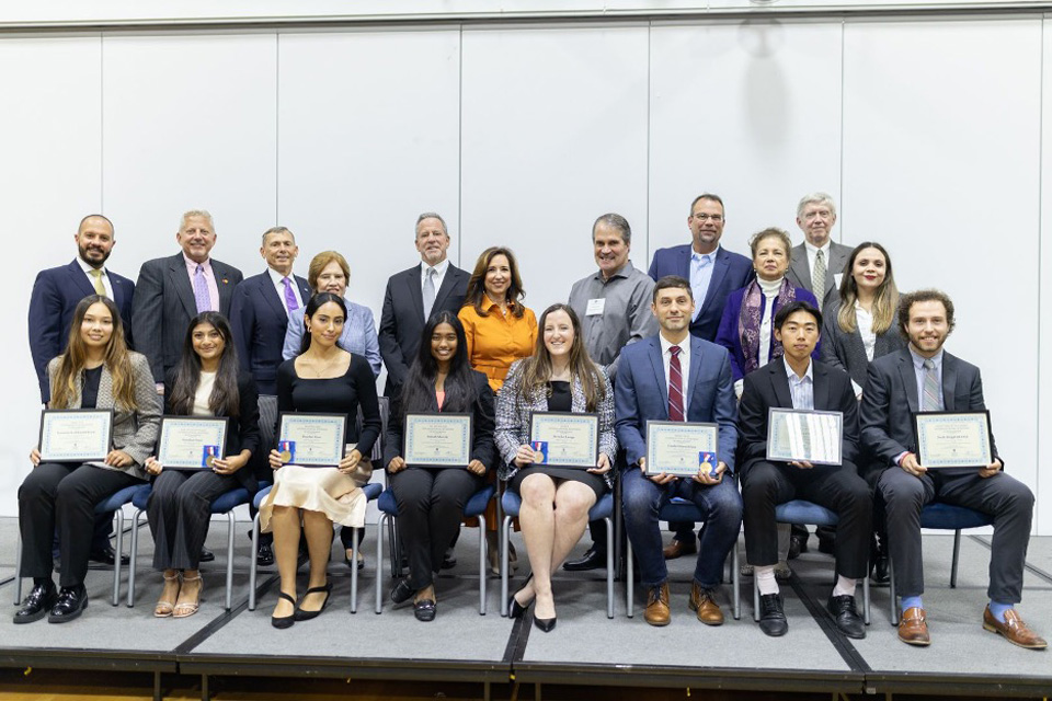 2023 International Business Awards Honorees Pose On Stage for a Group Photo with their Awards