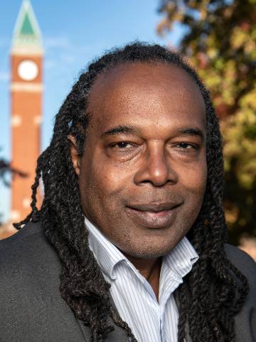 Jonathan Smith Headshot with clock tower in the background.