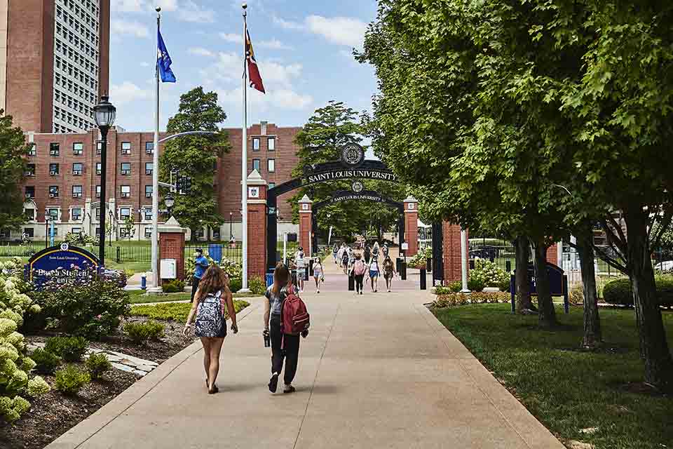 People walking through SLU's Grand Boulevard gateway on a summer day