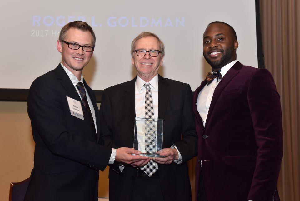 Roger Goldman on stage with Dean William Johnson to receive award