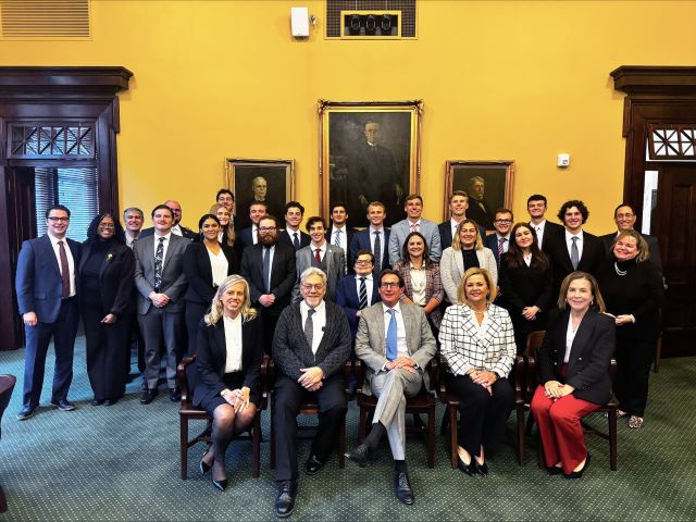 The Friday Sandwich Review Society students are joined in a group photo with SLU LAW deans and the Missouri Supeme Court Justices A large group of students and court members in professional dress pose for a photo in the courthouse.