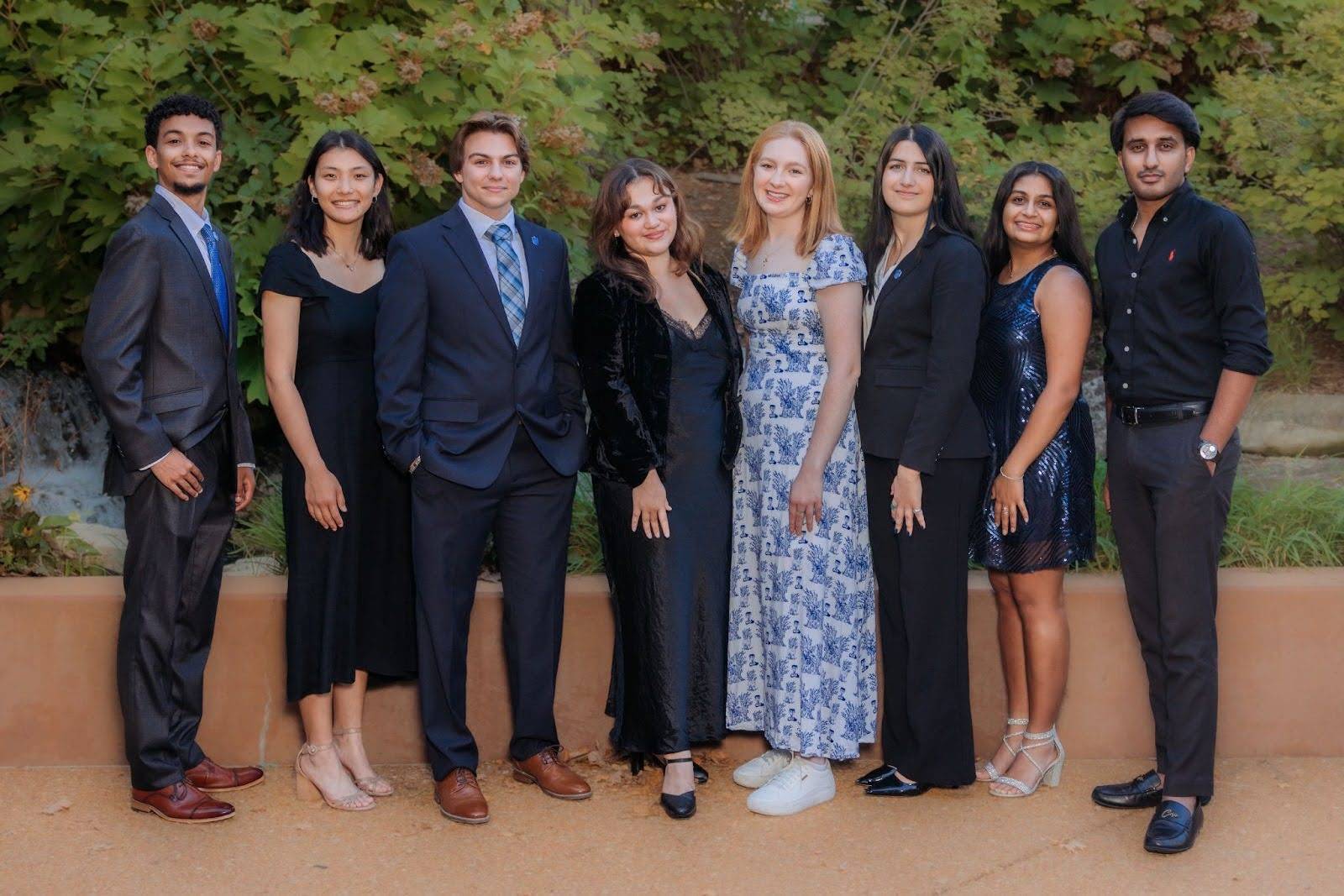 Eight Saint Louis University Student Government Association Executive Board Members pose for a photo.