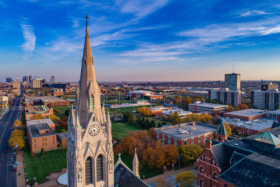 An aerial photo of north campus looking east toward the St. Louis skyline at sunset.