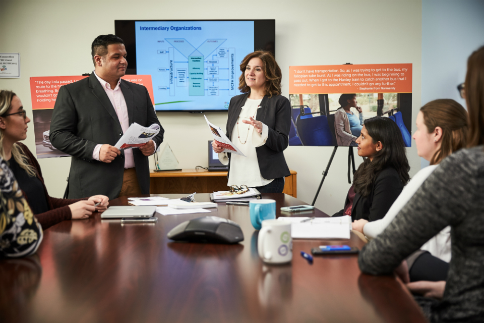 Office of Public Health photo showing a discussion