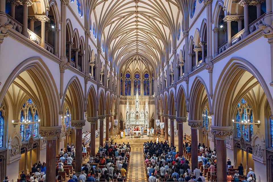 Students fill the pews of at St. Francis Xavier College Church.